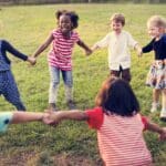 diverse group of kids playing in a circle