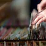 woman sorting through file drawer